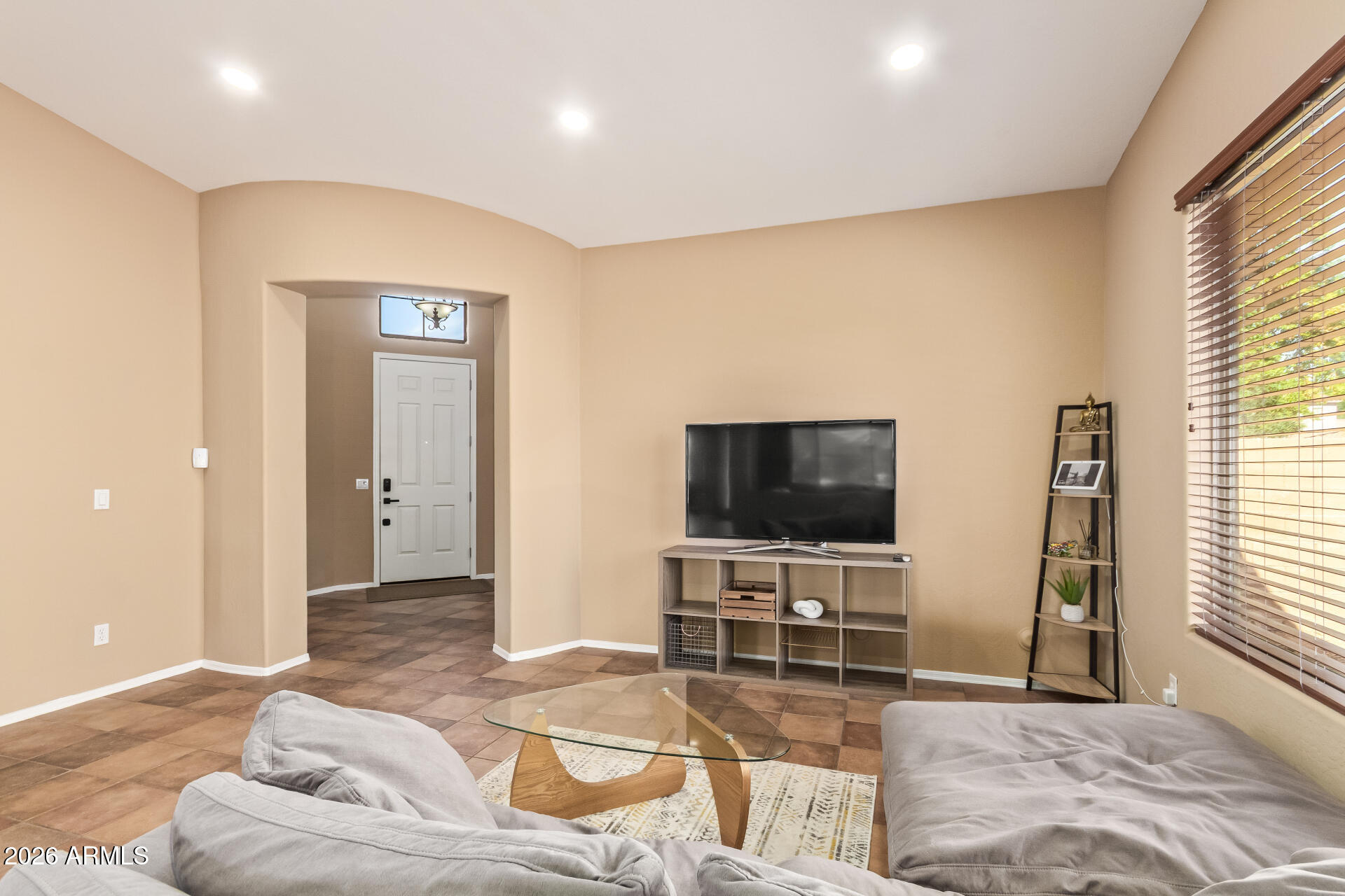 2115 West Branham Lane Phoenix, AZ 85041 - Photo 12 of 35 a living room with furniture and a flat screen tv