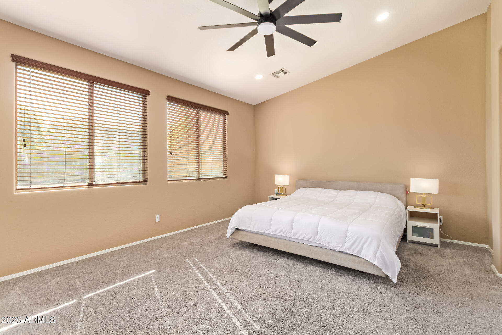 2115 West Branham Lane Phoenix, AZ 85041 - Photo 17 of 35 a bedroom with a bed and window