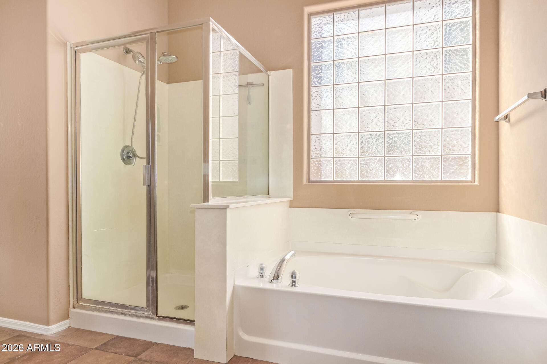 2115 West Branham Lane Phoenix, AZ 85041 - Photo 20 of 35 a bathroom with a bathtub and a shower