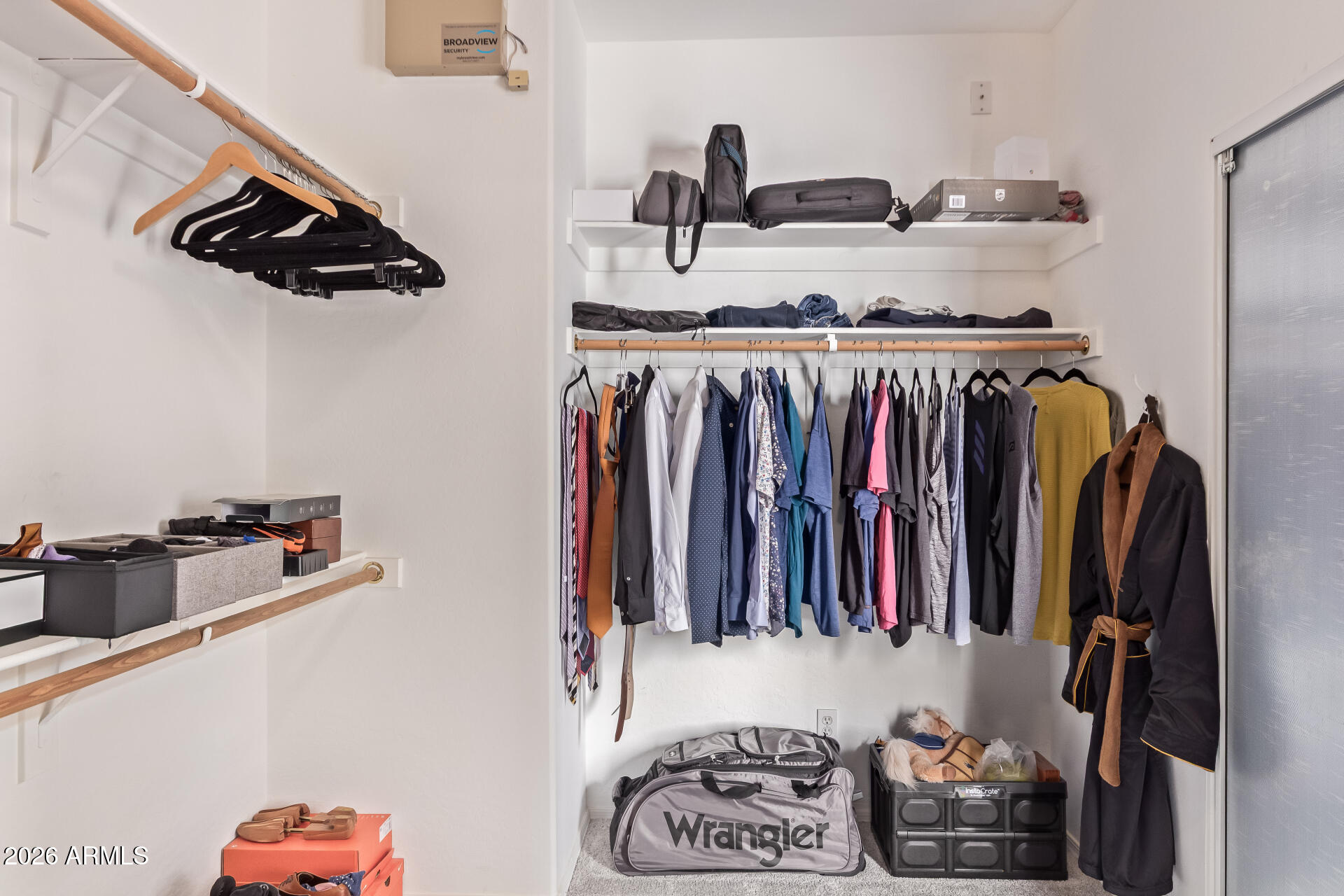 2115 West Branham Lane Phoenix, AZ 85041 - Photo 21 of 35 a view of walk in closet with clothes and shoes