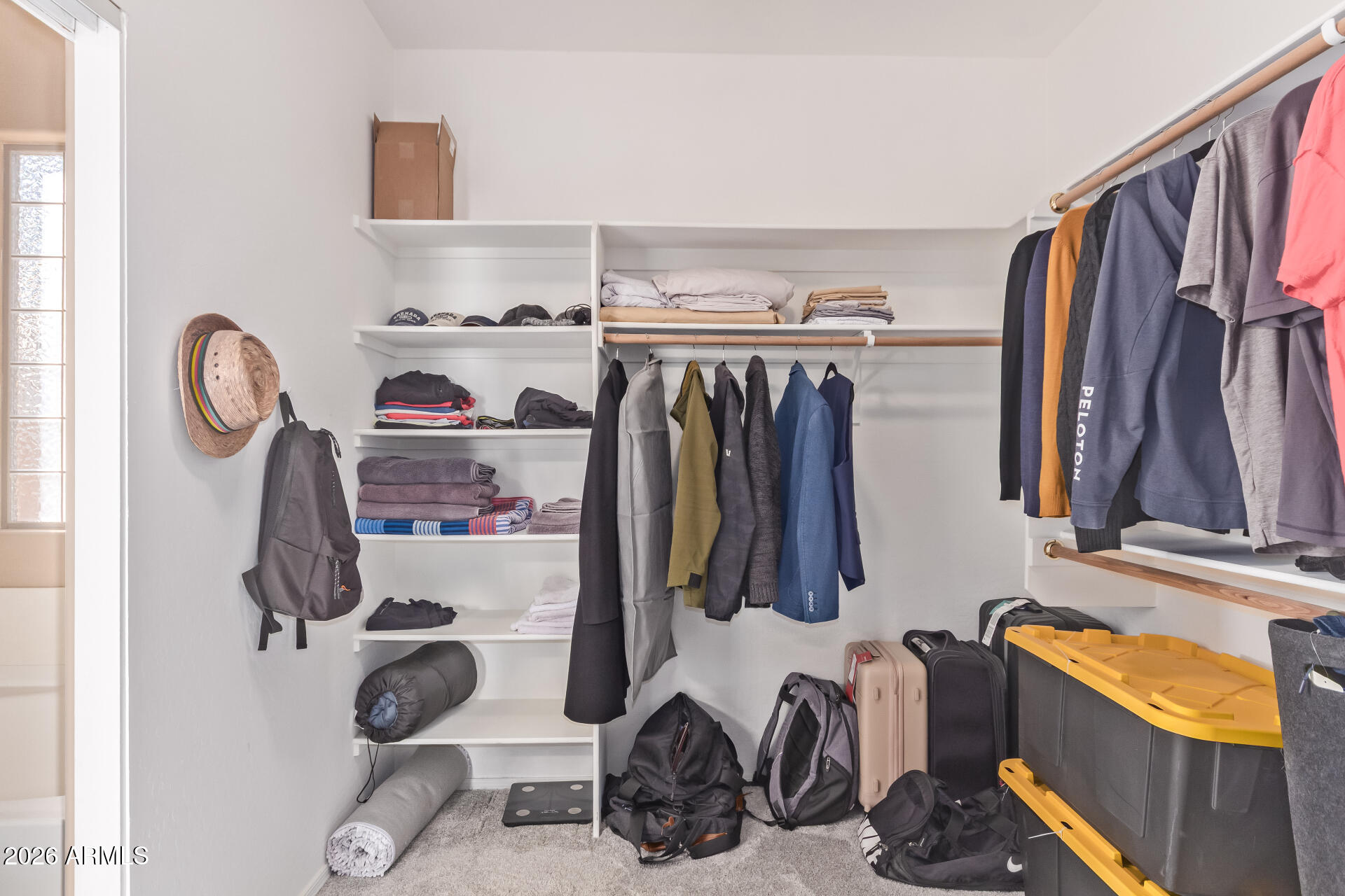 2115 West Branham Lane Phoenix, AZ 85041 - Photo 22 of 35 a view of walk in closet with clothes and shoes