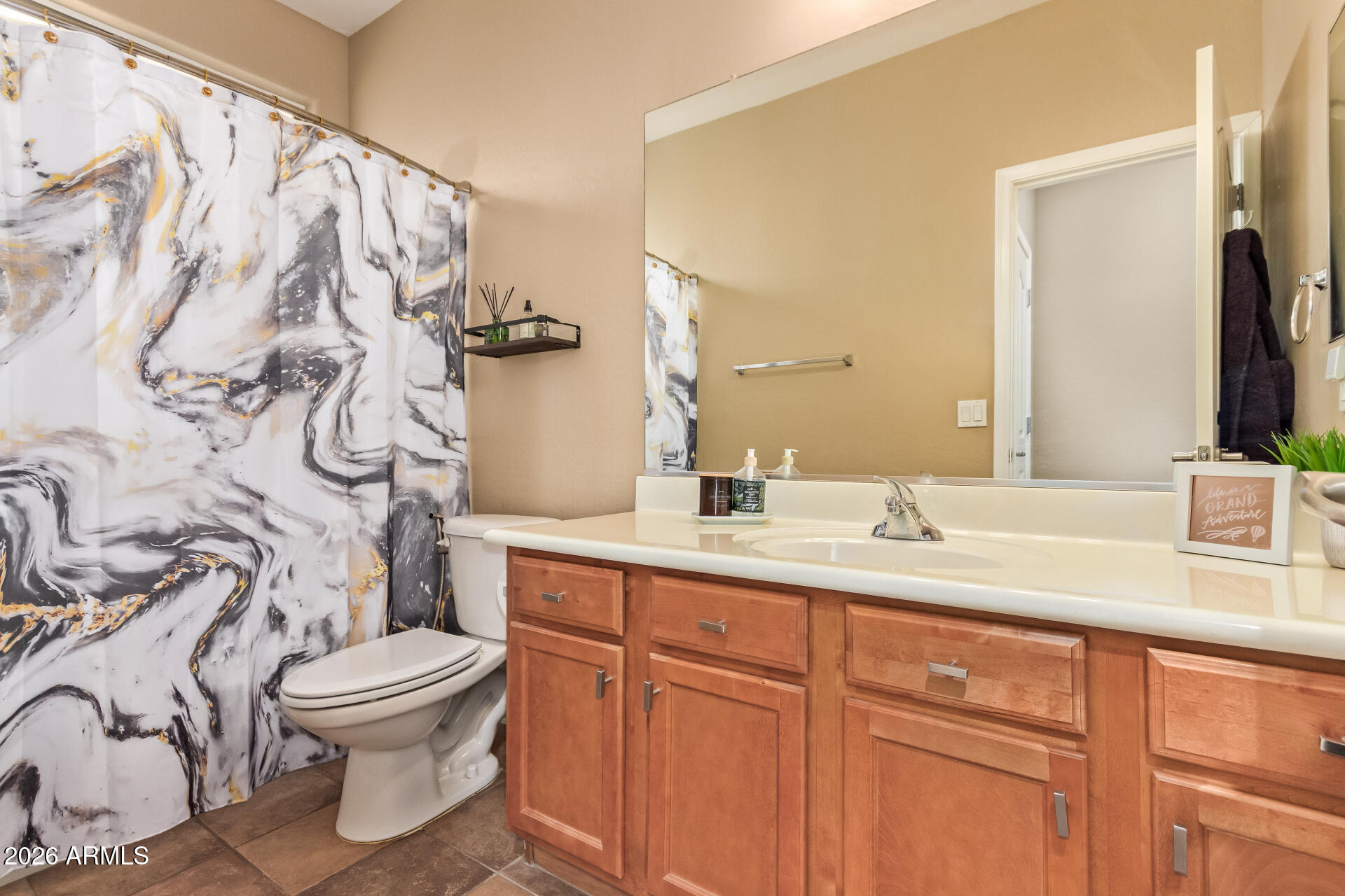 2115 West Branham Lane Phoenix, AZ 85041 - Photo 25 of 35 a bathroom with a granite countertop sink and a mirror