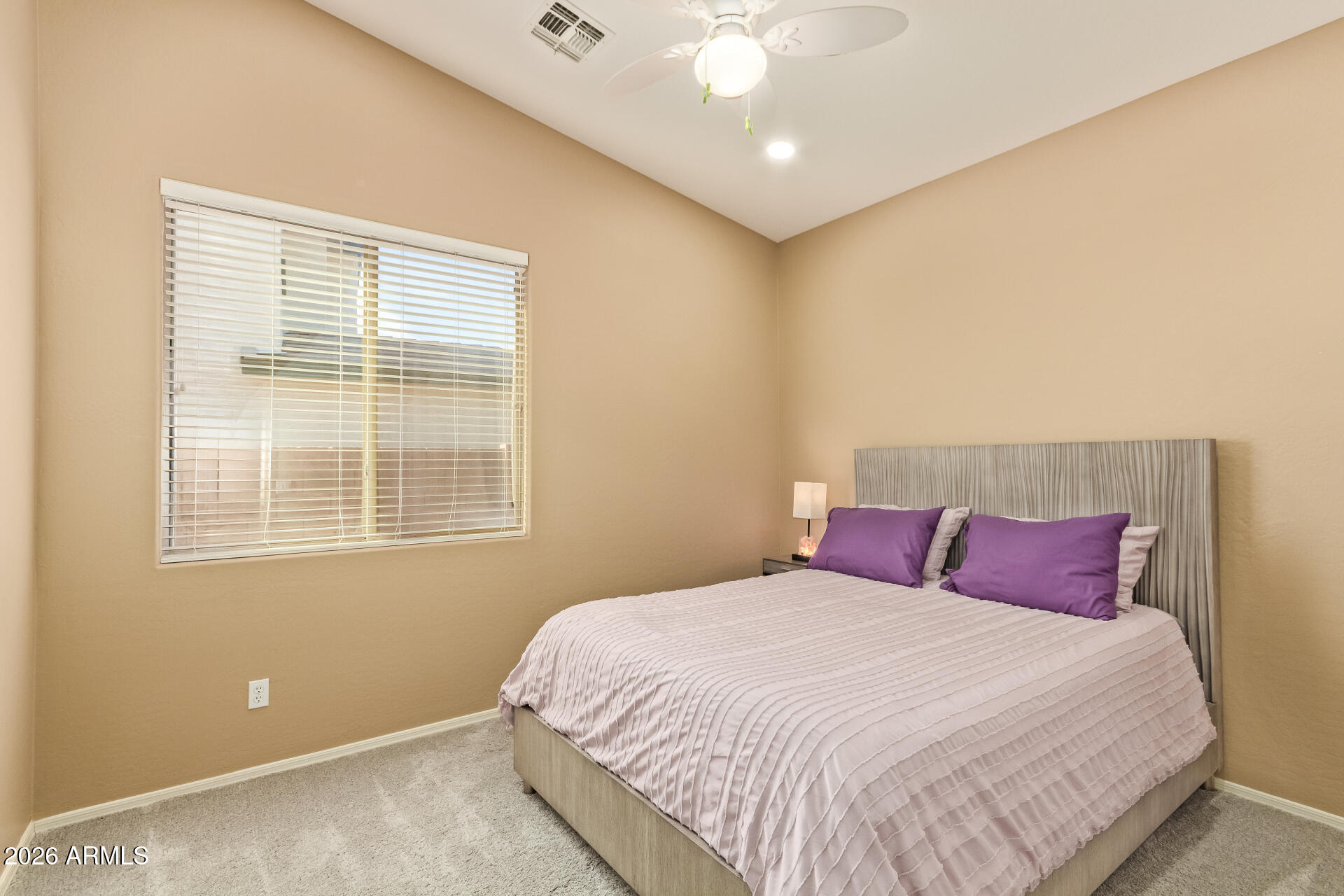 2115 West Branham Lane Phoenix, AZ 85041 - Photo 26 of 35 a bedroom with a bed and a window