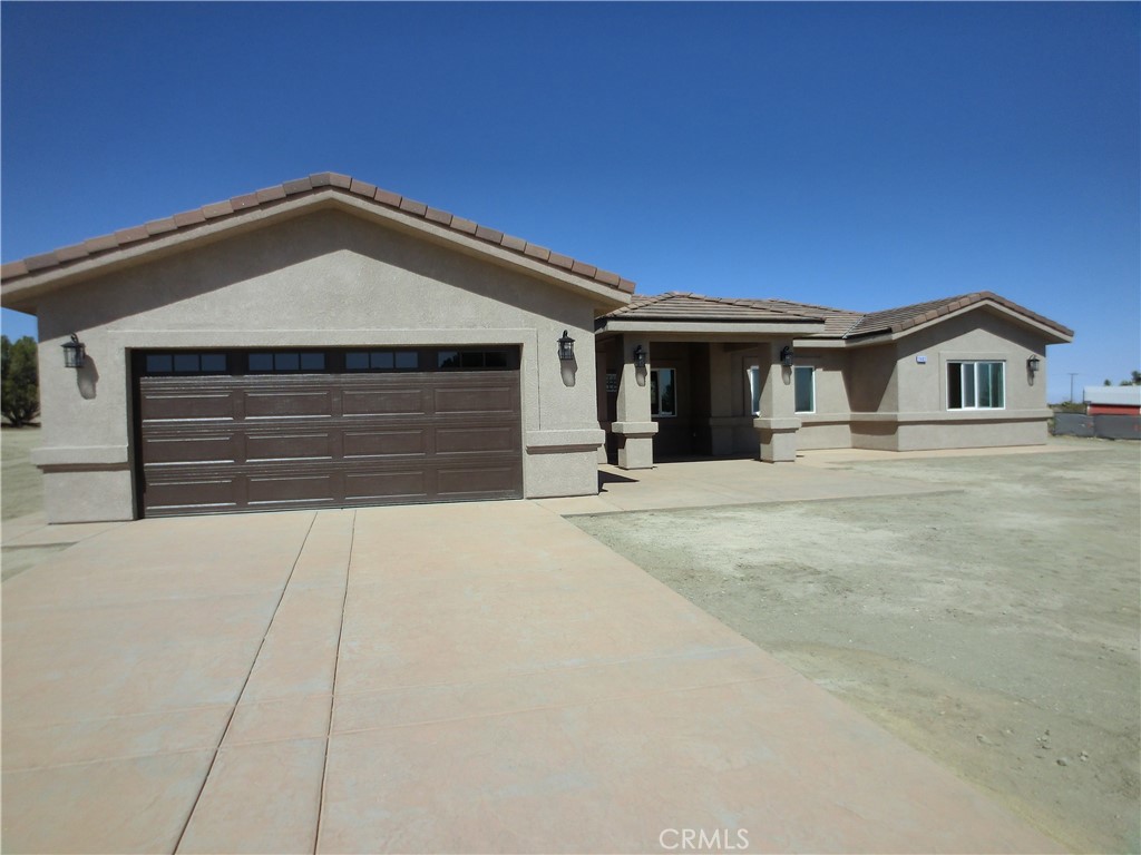 11462 Prado Road Pinon Hills, CA 92372 - Photo 1 of 18 a front view of a house with a yard