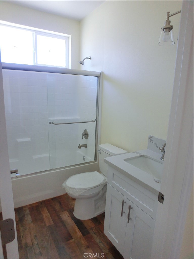 11462 Prado Road Pinon Hills, CA 92372 - Photo 14 of 18 a bathroom with a granite countertop toilet and a sink