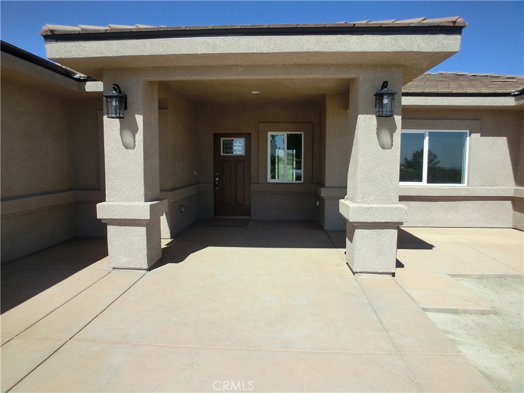 11462 Prado Road Pinon Hills, CA 92372 - Photo 3 of 18 a view of a entryway door of the house