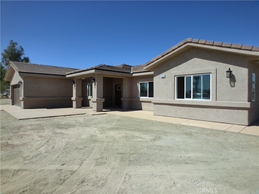 11462 Prado Road Pinon Hills, CA 92372 - Photo 4 of 18 a front view of a house with a garage