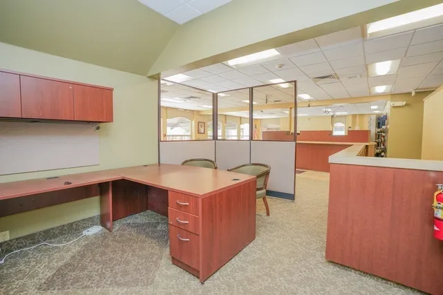 a dining room with a table and chairs