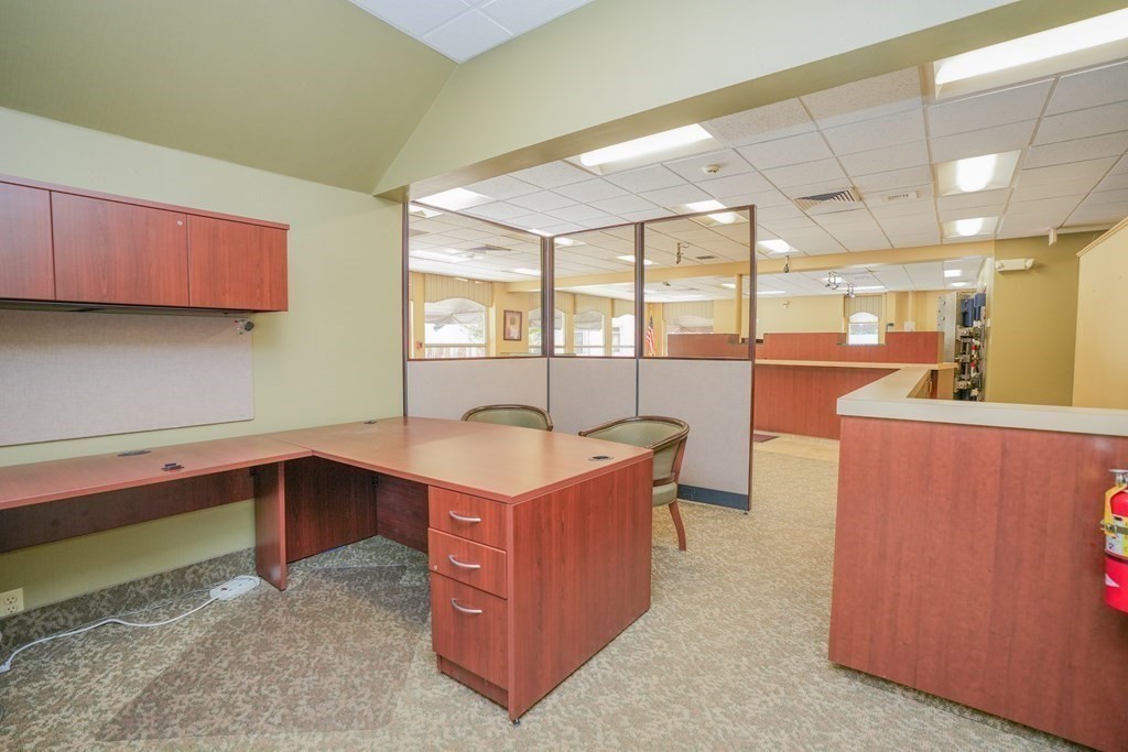 968 Main Street Warren, MA 01083 - Photo 20 of 40 a view of a kitchen with kitchen island a sink a stove and a refrigerator