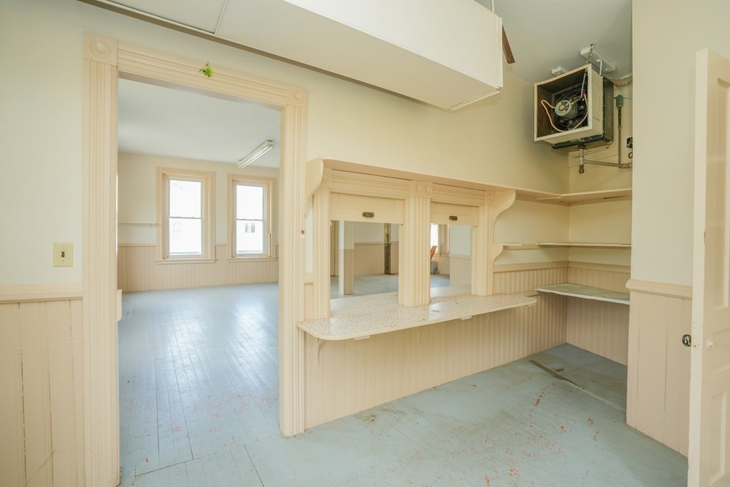 968 Main Street Warren, MA 01083 - Photo 37 of 40 a view of a hallway with wooden floor and a bathroom
