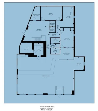 a room with lots of counter top space and stainless steel appliances