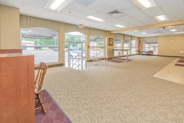 a area with furniture and a large window