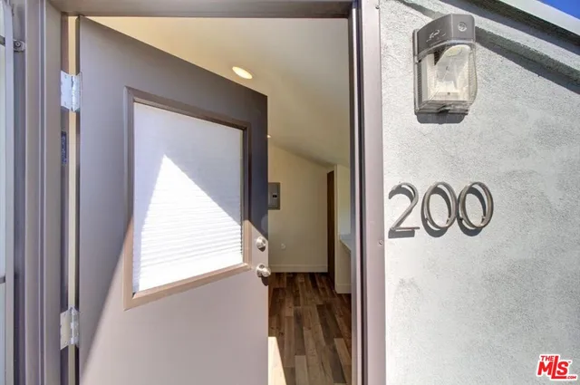 a view of a door and a window