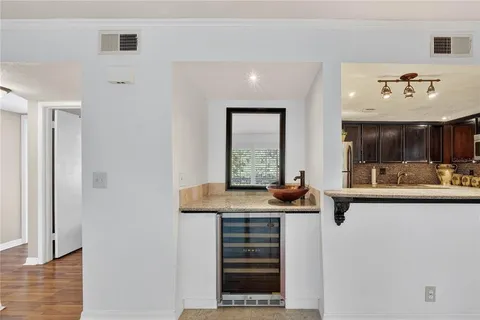 a view of an chairs and table in the balcony