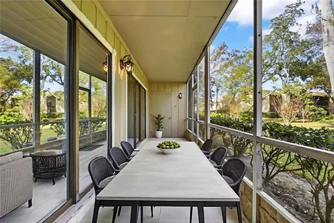 a bedroom with a bed and a flat tv screen on dresser