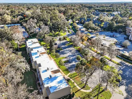 an aerial view of residential houses with outdoor space