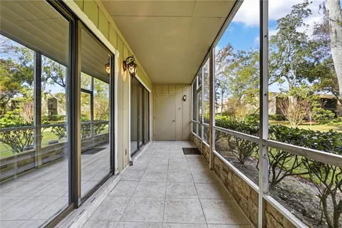 a bedroom with a bed dresser and a large window