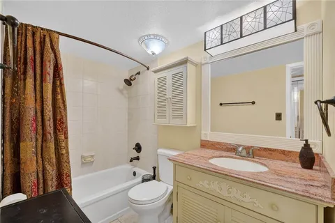 a view of a workspace with furniture and wooden floor
