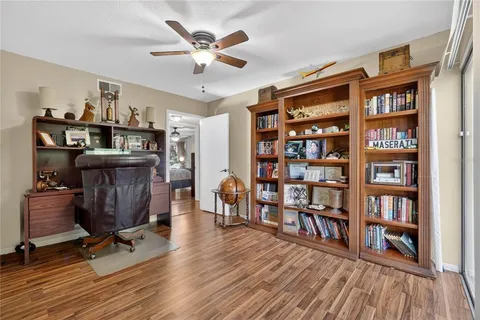 a bedroom with a large bed and a large window