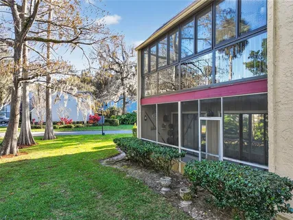 an aerial view of a house with a yard and garden