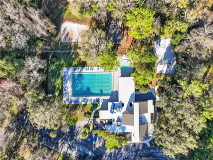 a view of a swimming pool with a patio