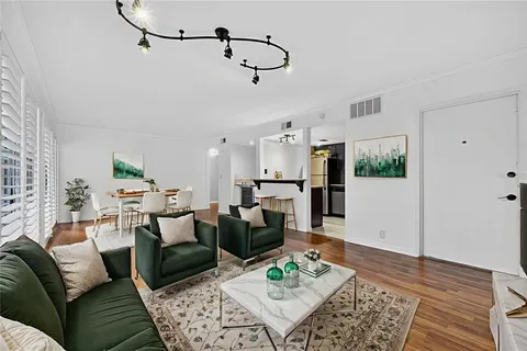 a kitchen with granite countertop stainless steel appliances and wooden cabinets