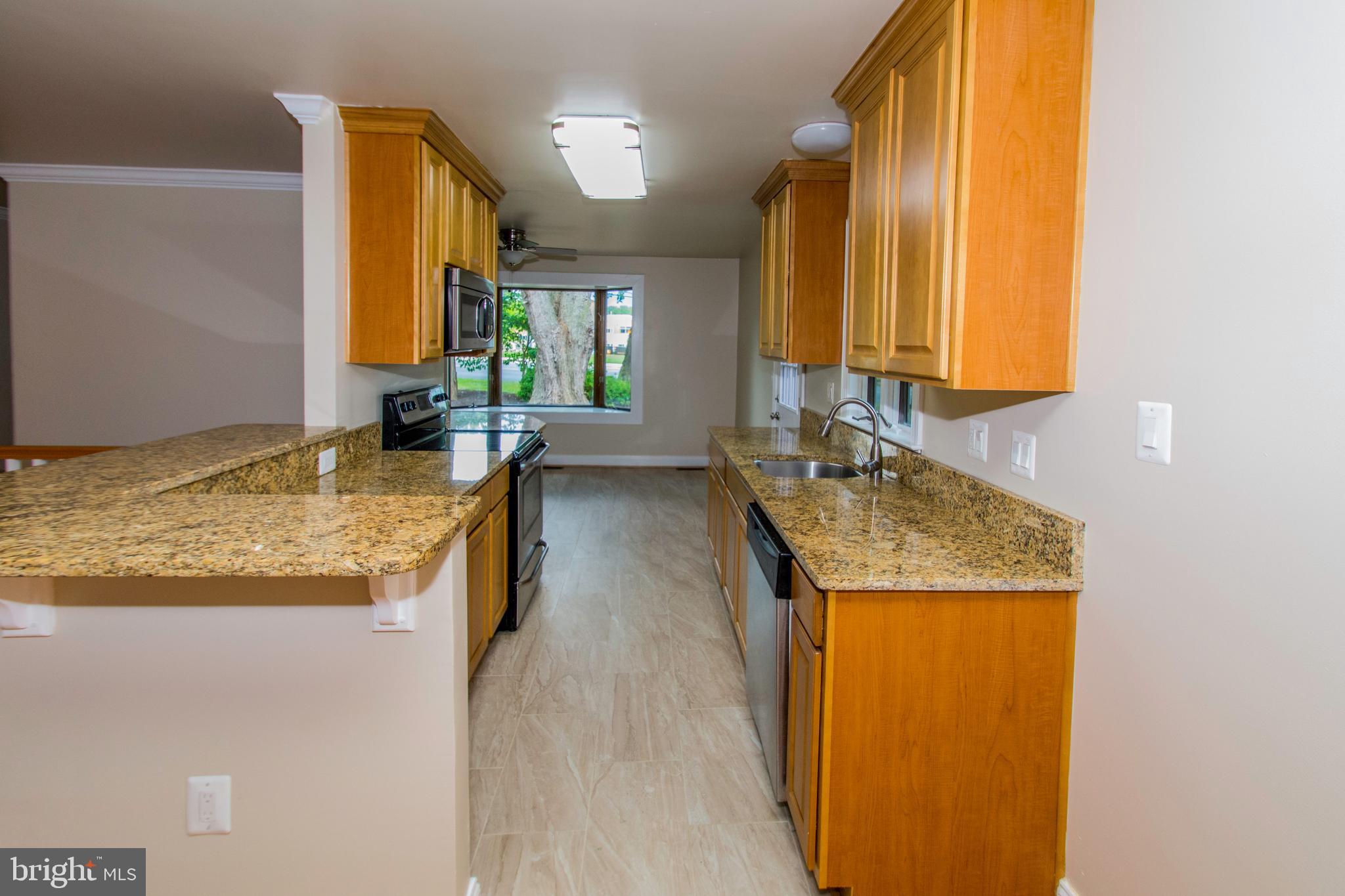 1990 Valley Road Annapolis, MD 21401 - Photo 20 of 74 Bright open galley style kitchen with bar