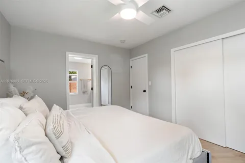 a large white bed in a white room
