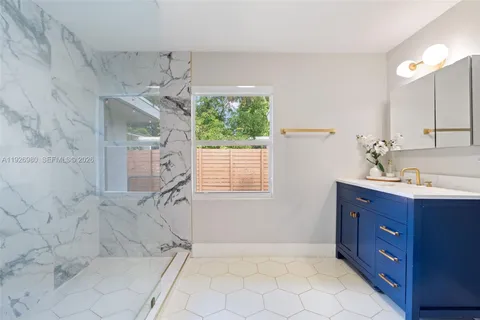 a bathroom with a toilet sink and shower