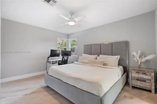 a large white bed in a white room