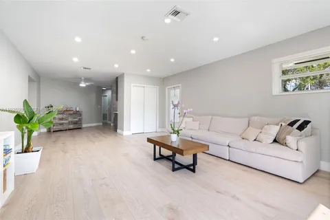 a kitchen with cabinets a sink and stainless steel appliances