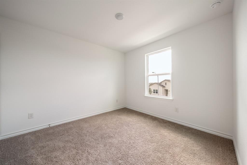 123 Watkinville Road Hutto, TX 78634 - Photo 15 of 30 Carpeted spare room featuring baseboards