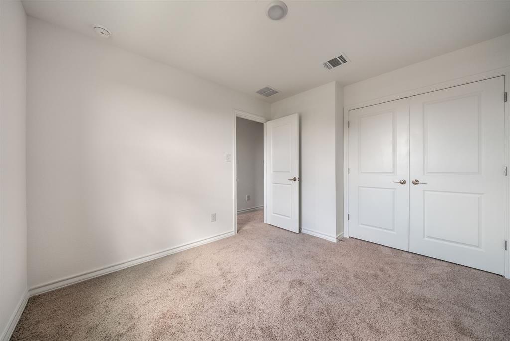 123 Watkinville Road Hutto, TX 78634 - Photo 16 of 30 Unfurnished bedroom with carpet flooring and a closet