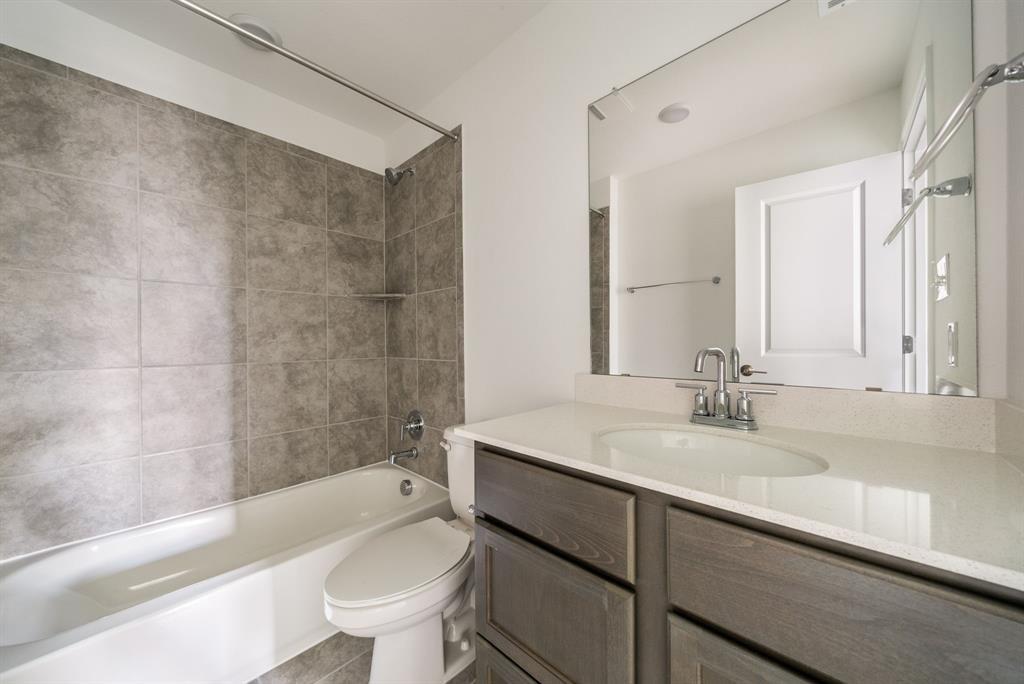 123 Watkinville Road Hutto, TX 78634 - Photo 20 of 30 Full bathroom featuring vanity and shower / tub combination