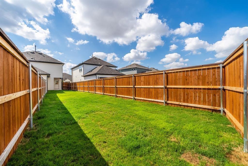 123 Watkinville Road Hutto, TX 78634 - Photo 25 of 30 Fenced backyard featuring a residential view