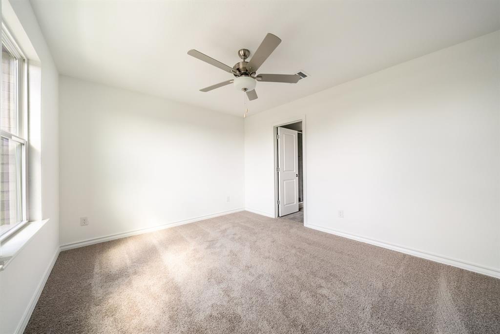 123 Watkinville Road Hutto, TX 78634 - Photo 8 of 30 Carpeted spare room with baseboards and ceiling fan