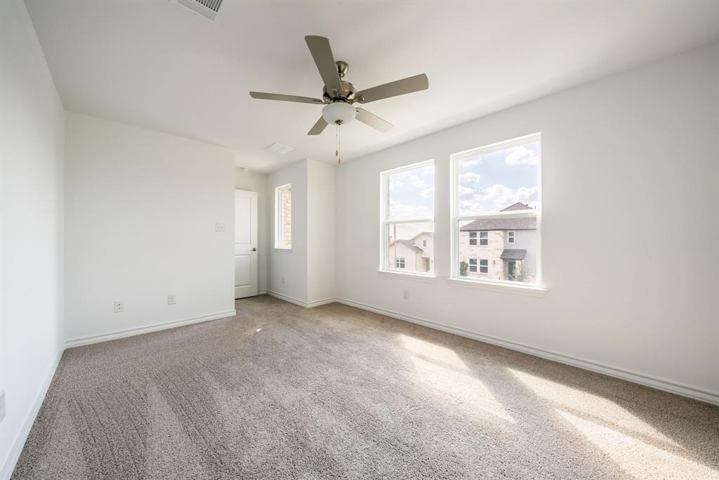 123 Watkinville Road Hutto, TX 78634 - Photo 9 of 30 Carpeted empty room featuring baseboards and ceiling fan