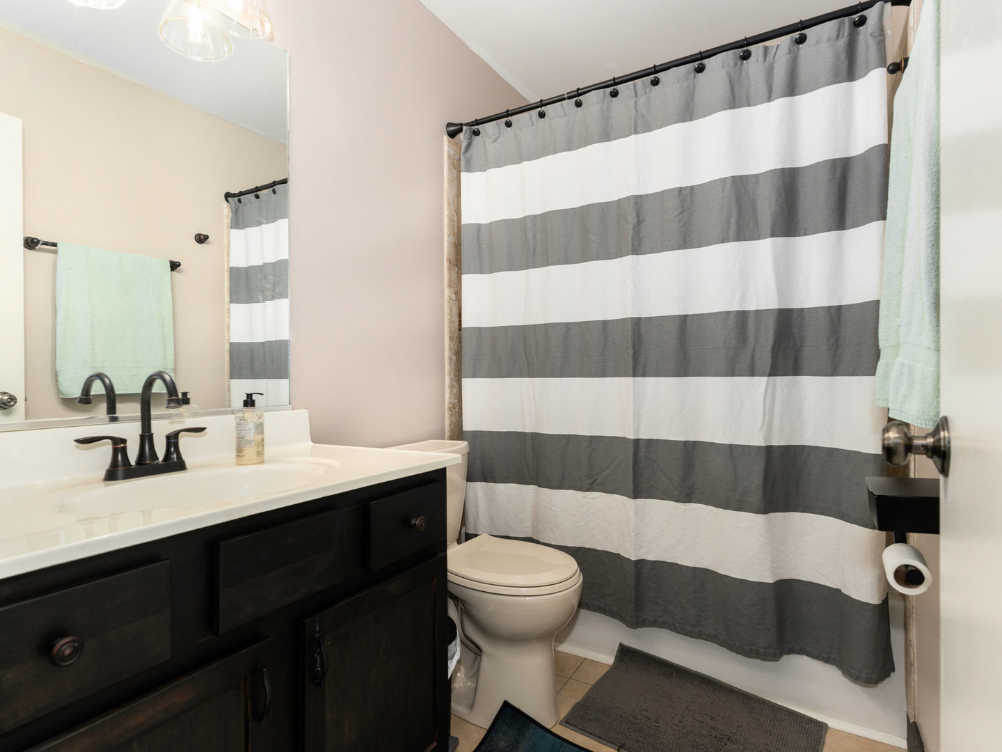 1416 Trailside Drive Beecher, IL 60401 - Photo 15 of 24 a bathroom with a sink a toilet a mirror and shower