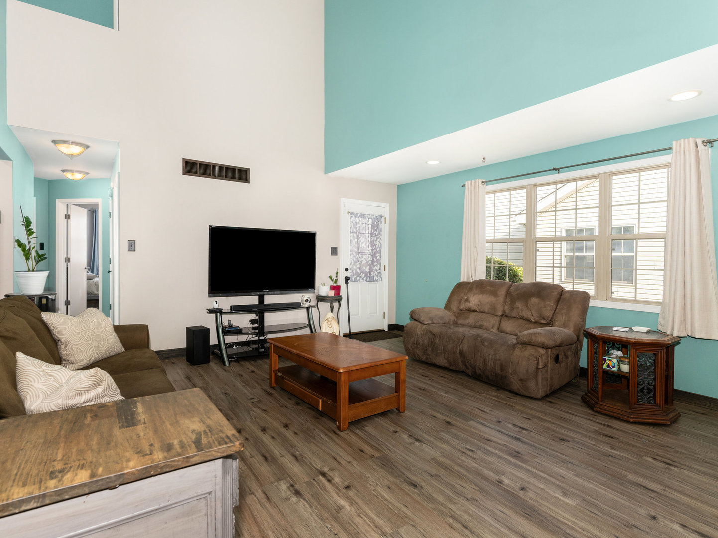 1416 Trailside Drive Beecher, IL 60401 - Photo 2 of 24 a living room with furniture and a flat screen tv