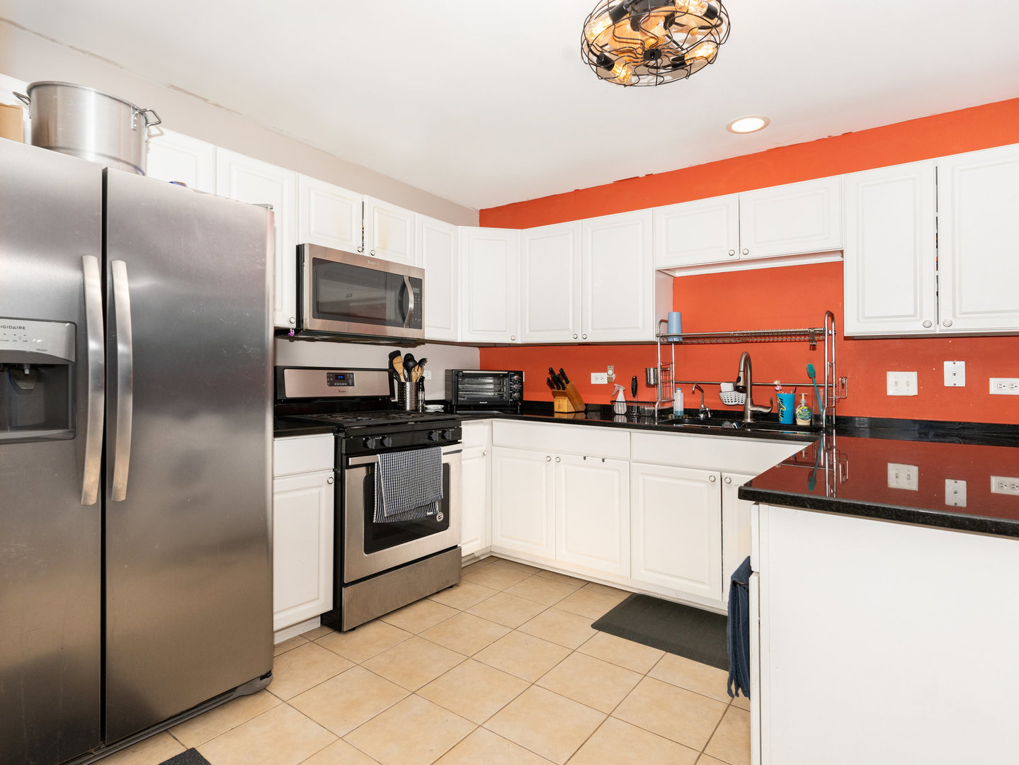 1416 Trailside Drive Beecher, IL 60401 - Photo 5 of 24 a kitchen with stainless steel appliances a refrigerator sink and microwave