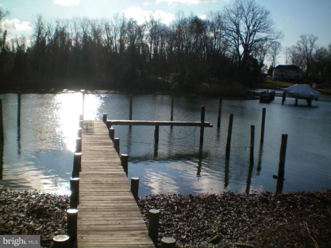 613 Truxton Road Annapolis, MD 21409 - Photo 15 of 24 a view of a pathway with a wrought fence