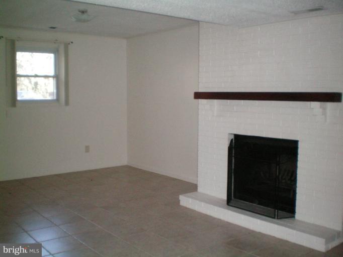 613 Truxton Road Annapolis, MD 21409 - Photo 18 of 24 a living room with a fireplace