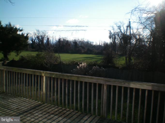 613 Truxton Road Annapolis, MD 21409 - Photo 20 of 24 a wooden deck with sunset view