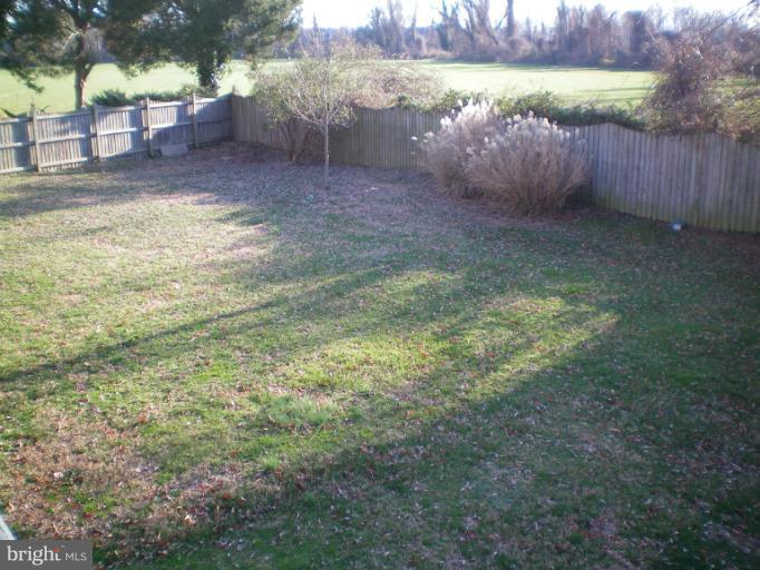 613 Truxton Road Annapolis, MD 21409 - Photo 8 of 24 a view of a yard with wooden fence