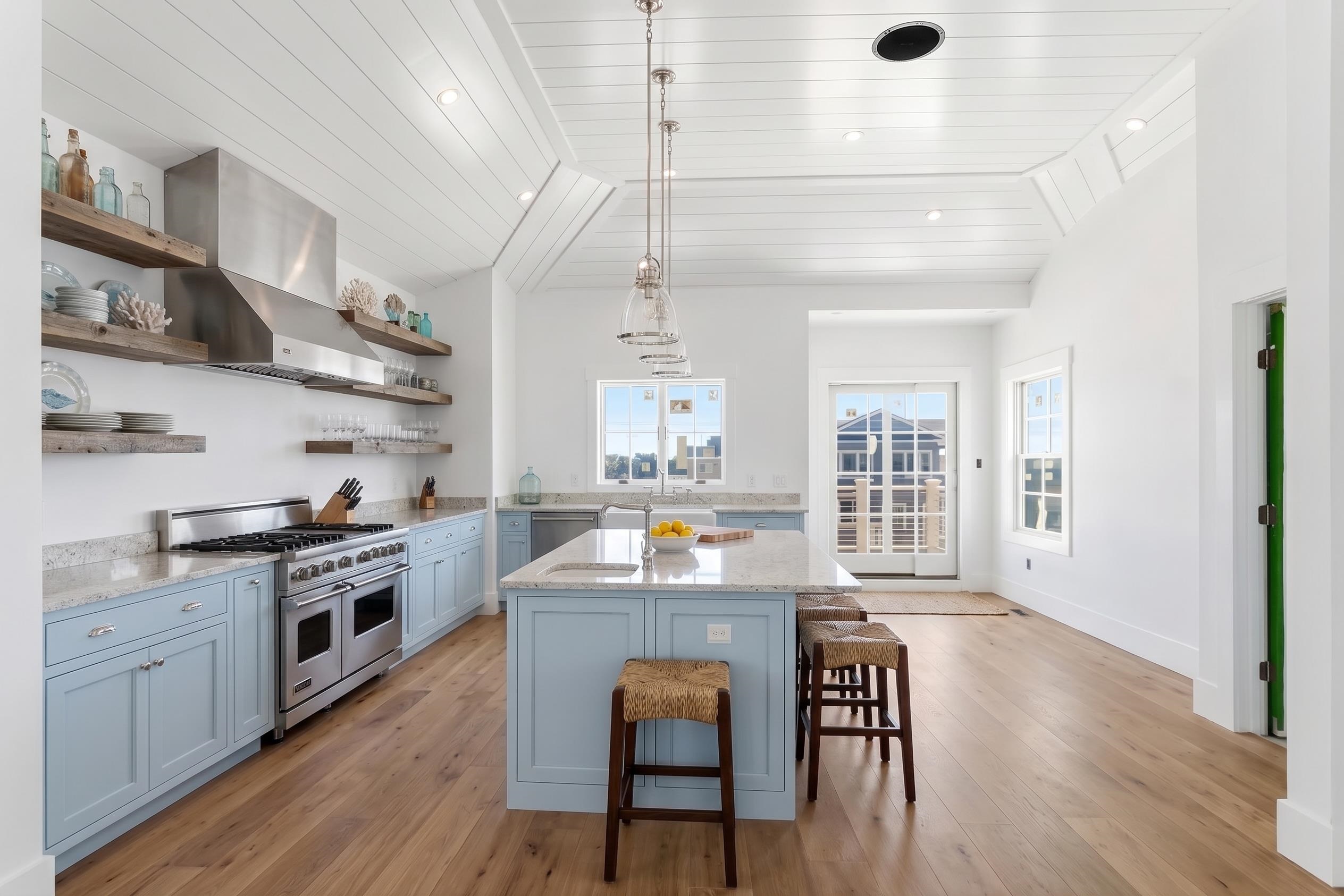 8527 3rd Stone Harbor, NJ 08247 - Photo 4 of 28 a large kitchen with cabinets wooden floor and stainless steel appliances