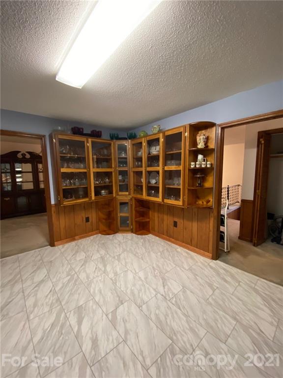 4903 Horseshoe Bend Road Hudson, NC 28638 - Photo 12 of 26 a view of an empty room with furniture and storage