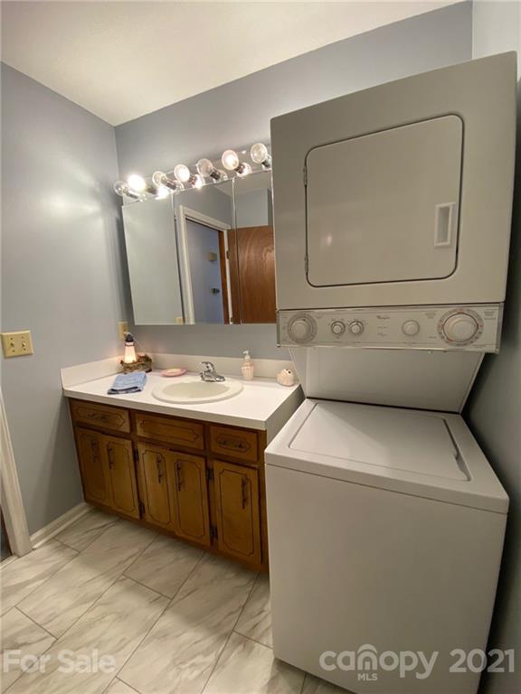 4903 Horseshoe Bend Road Hudson, NC 28638 - Photo 15 of 26 a bathroom with a toilet sink and mirror