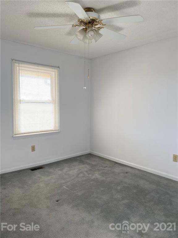 4903 Horseshoe Bend Road Hudson, NC 28638 - Photo 16 of 26 an empty room with a window