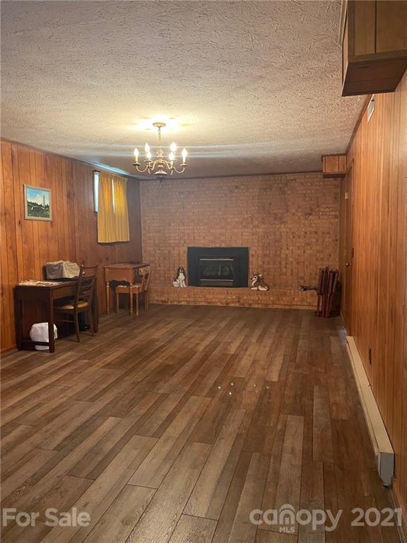 4903 Horseshoe Bend Road Hudson, NC 28638 - Photo 23 of 26 an empty room with wooden floor and furniture