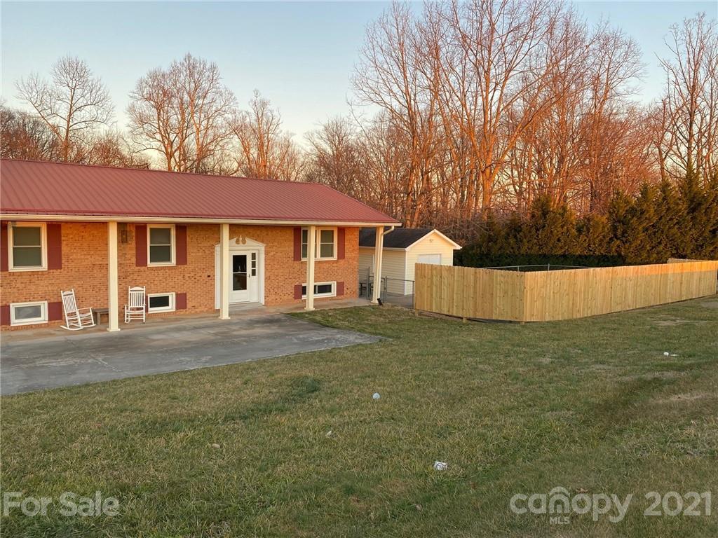 4903 Horseshoe Bend Road Hudson, NC 28638 - Photo 25 of 26 a view of a house with a yard